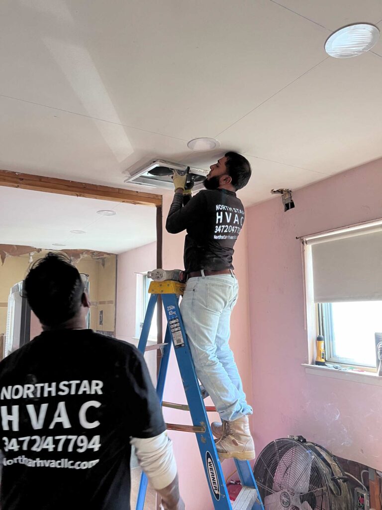 HVAC technician installing air conditioner in NYC home